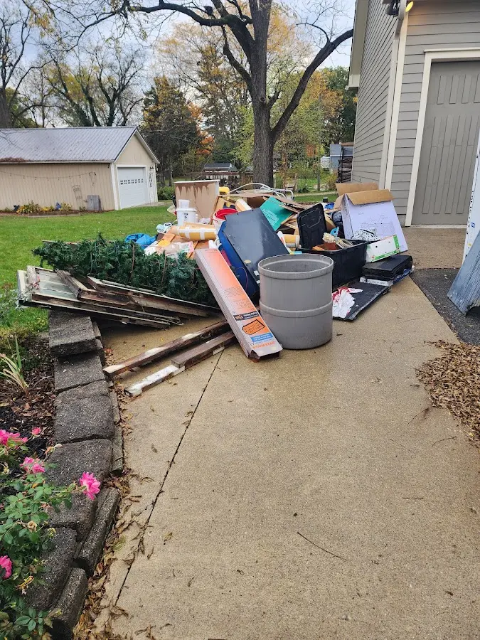 Dumpster being loaded with debris for 3 Yard Dumpster Rental in Granger
